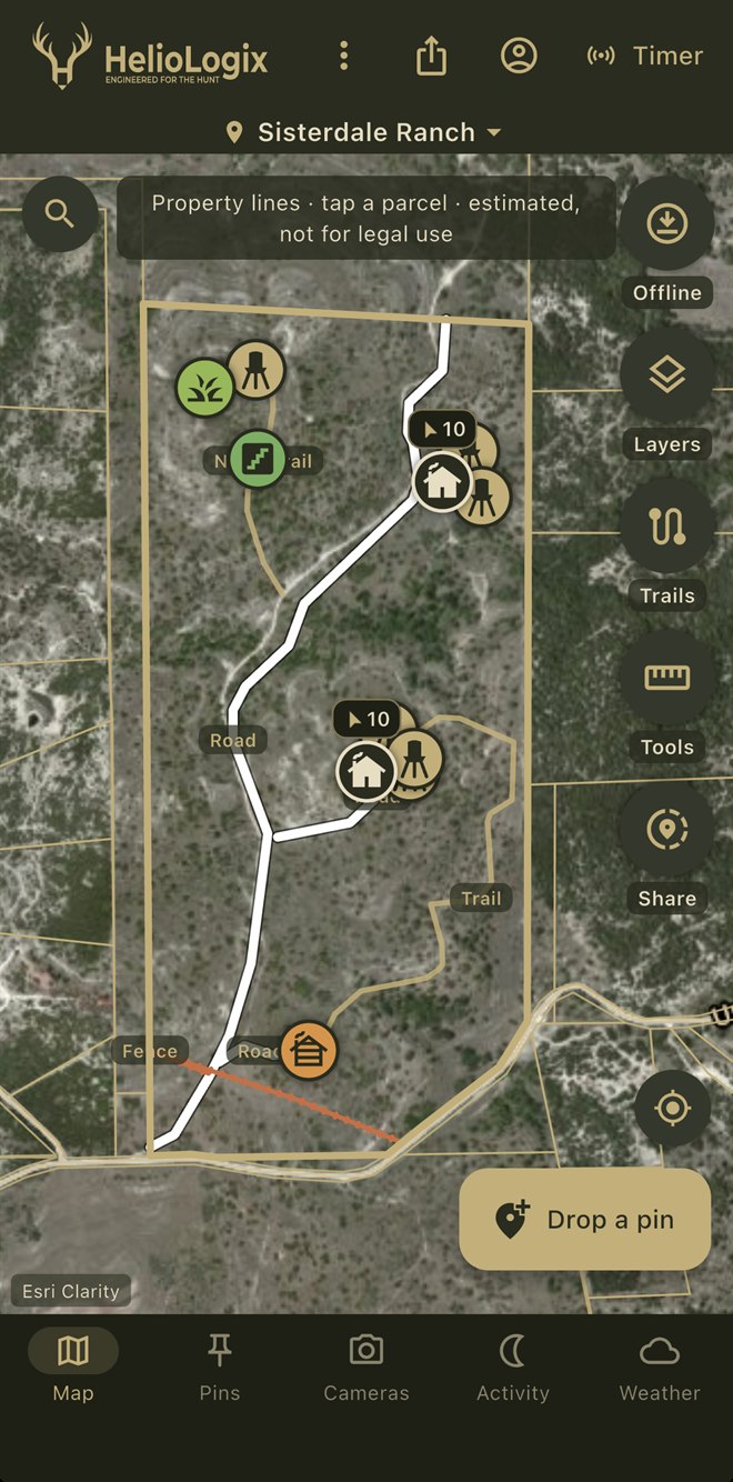 HelioMaps app showing Sisterdale Ranch, property lines, roads, trails, feeder and blind pins on satellite imagery